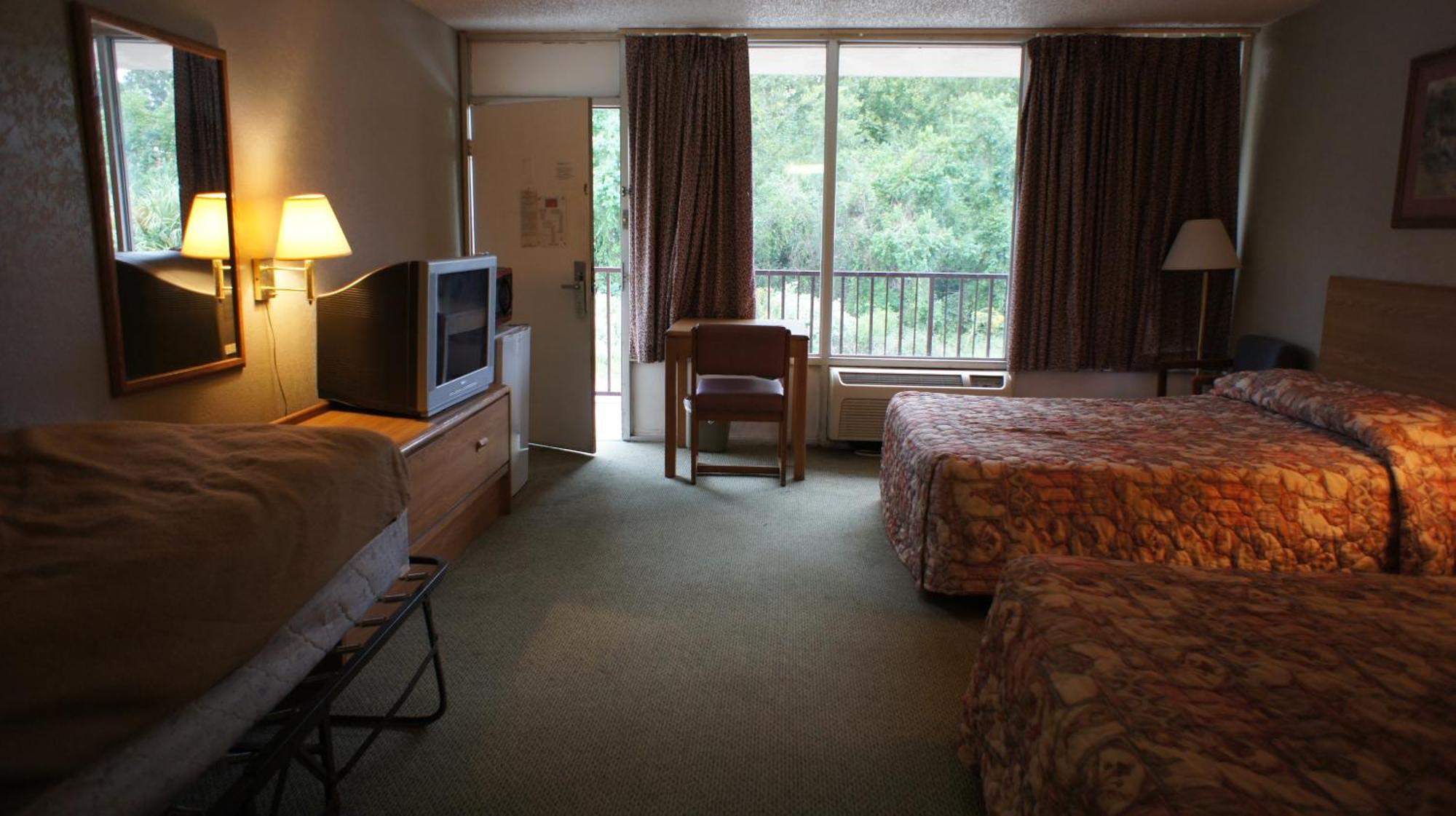 Executive Inn & Suites Orange Quarto foto