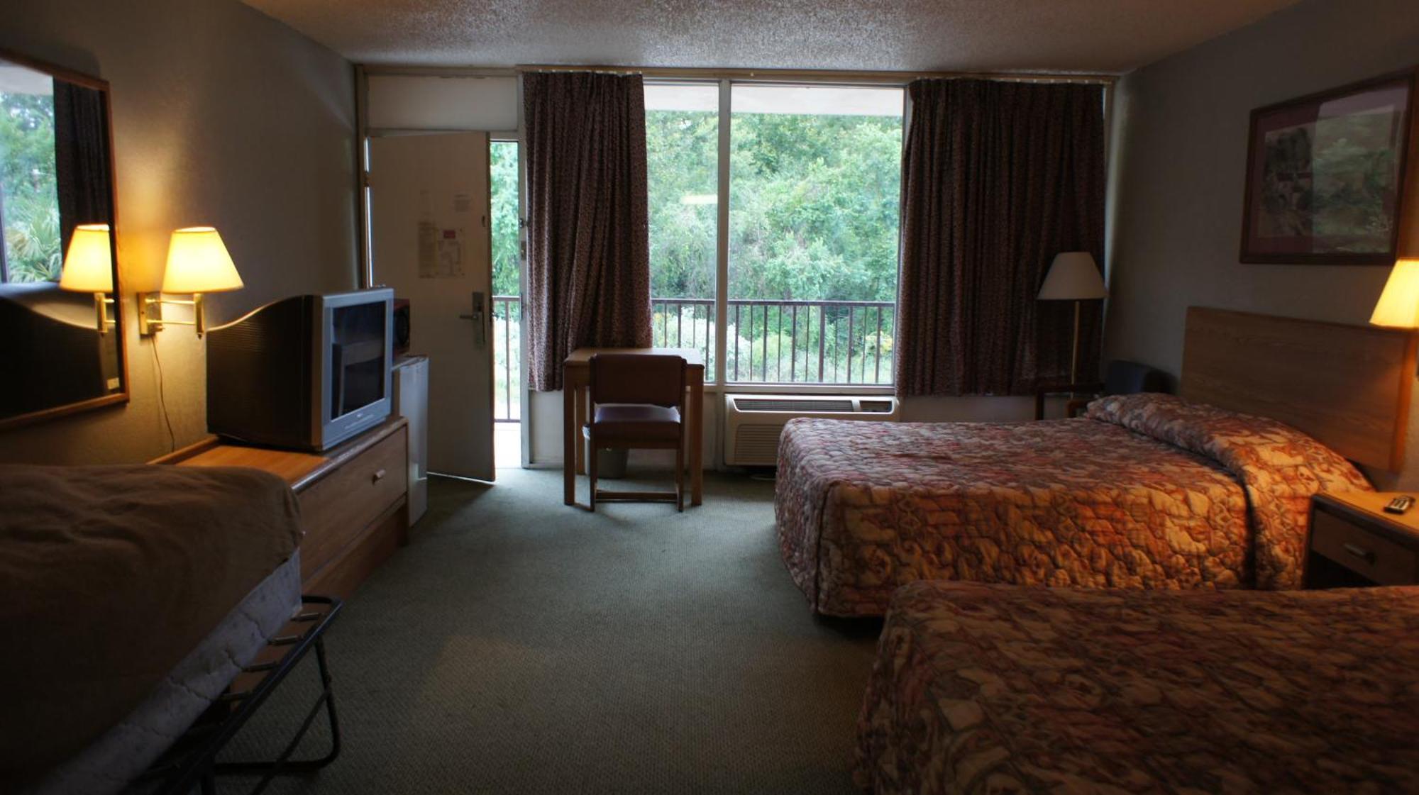Executive Inn & Suites Orange Quarto foto