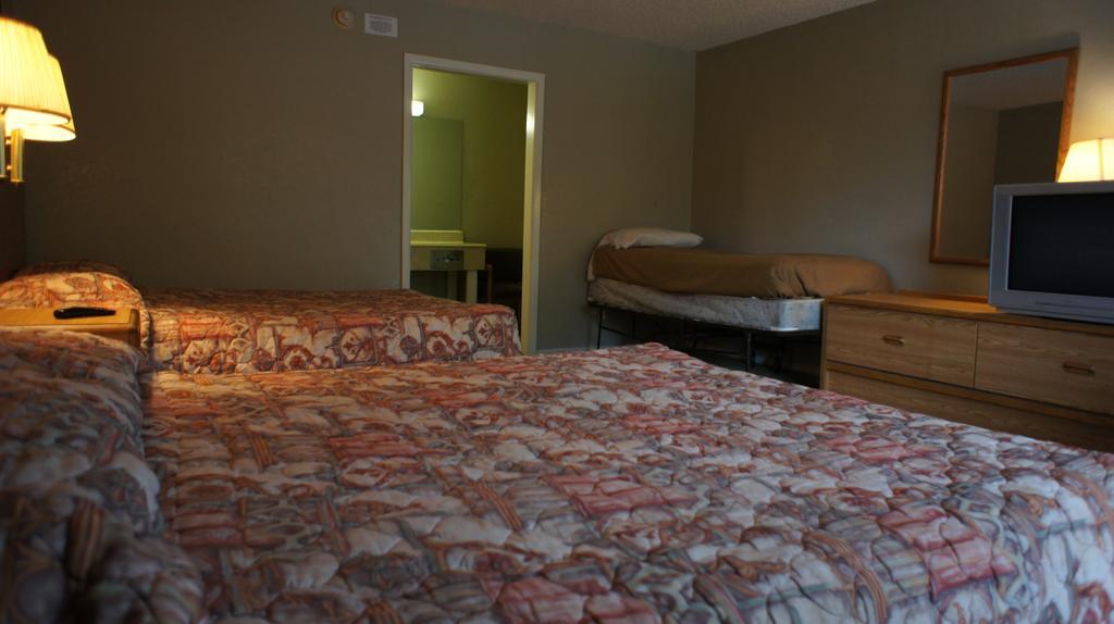 Executive Inn & Suites Orange Quarto foto